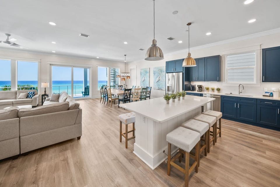 Step into your stunning ocean-view retreat where modern comfort meets coastal elegance. This open-concept space flows seamlessly from kitchen to living areas.