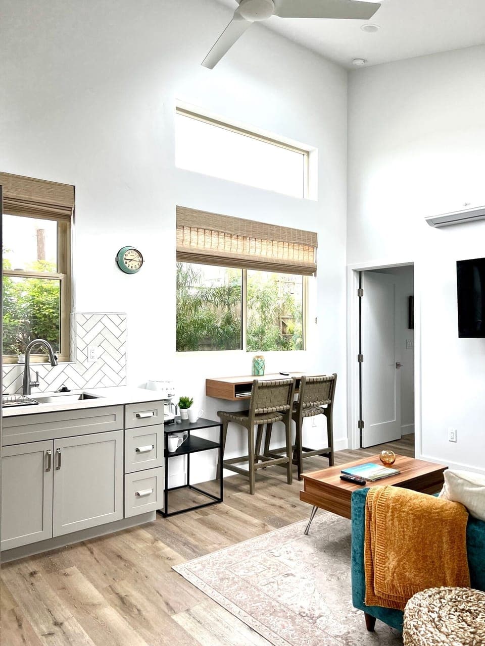 A nice workspace or breakfast nook. Beautiful tree shrubs line fence.