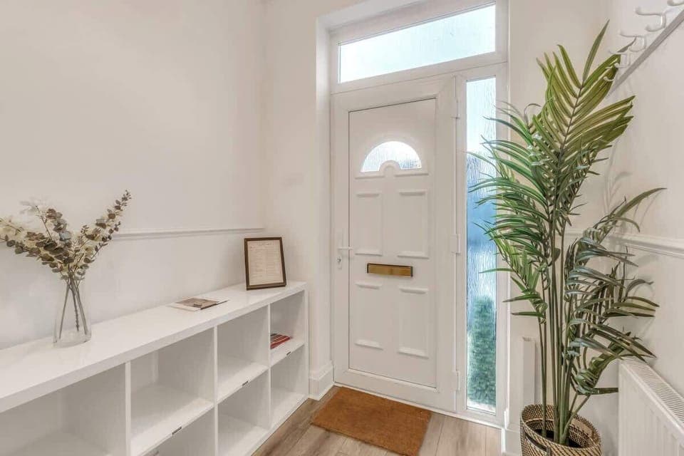 The entrance is wide and inviting with plenty of space to store your footwear and jackets.