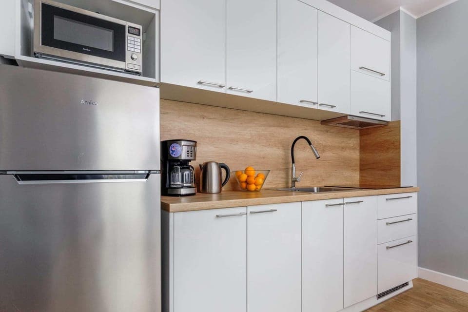 The fully equipped kitchenette includes everything you need for a home-cooked meal.