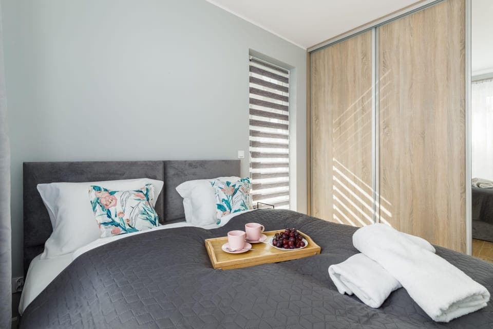 The bedroom's soft lighting and stylish decor ensure a cozy atmosphere.