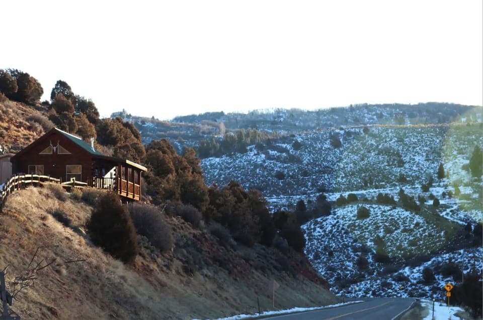 The cabin sits above CR 8.