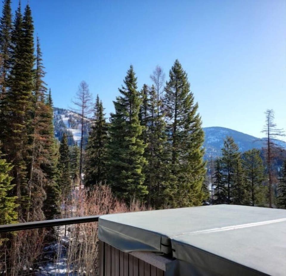 The private hot tub on the deck offers stunning views and ultimate relaxation. 