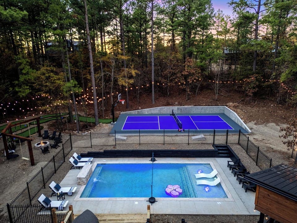 Your Year-round Retreat! Relax by the heated pool, play pickleball or basketball, and enjoy glow golf under towering pines. Relax on swings or loungers! 