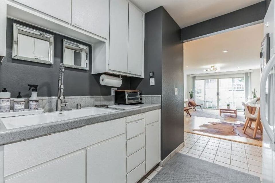 Kitchen with new stove, refrigerator and dishwasher.