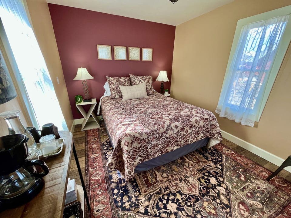 The violet cottage is decorated in colors or rust, gold, and blue. 