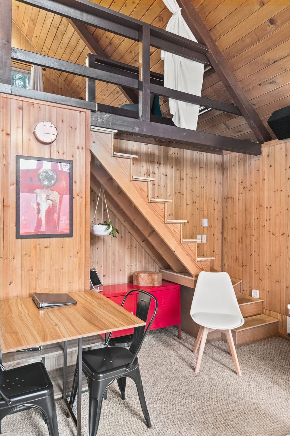 Loft bed is accessed from stairs. Second bedroom is on ground floor.