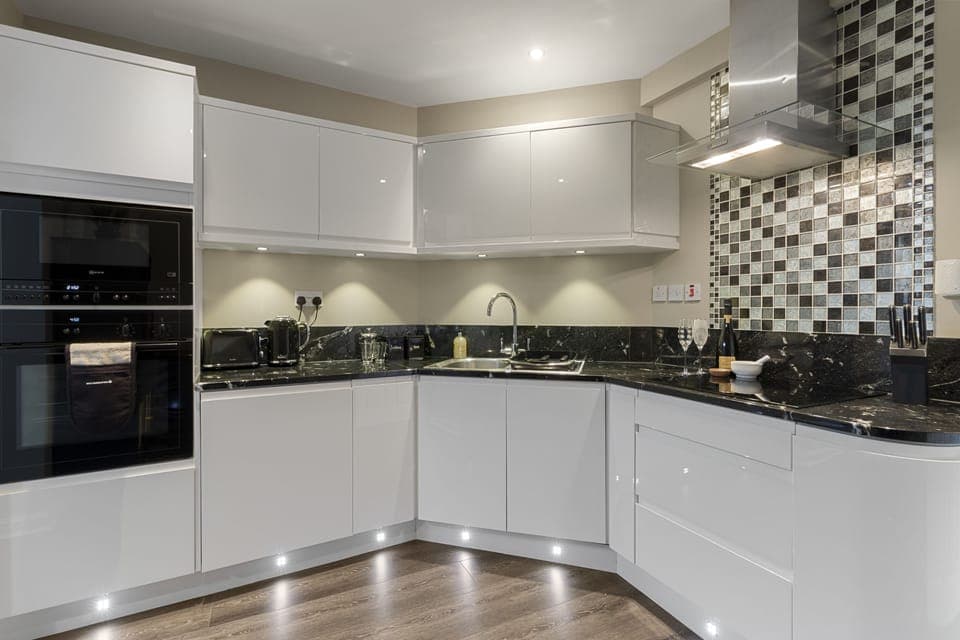 Enjoy preparing meals in the fully equipped kitchen, complete with integrated appliances and a large selection of crockery and glassware.