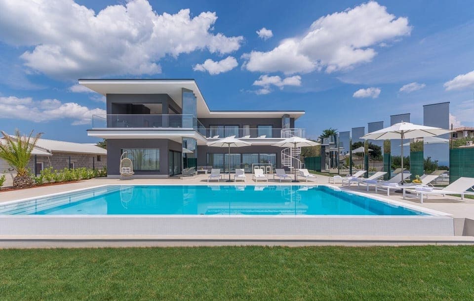 A view of the luxury villa Nimai Luce with a swimming pool in the town of Kaštelir in Istria