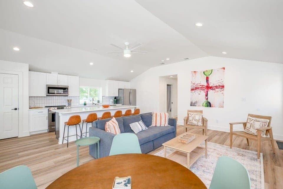 Kitchen large island with seating for 6, and seating for 4 at the back corner, plus seating for 4-10 outside on the patio. Kitchen comes stocked with everything you  need to make a basic meal.