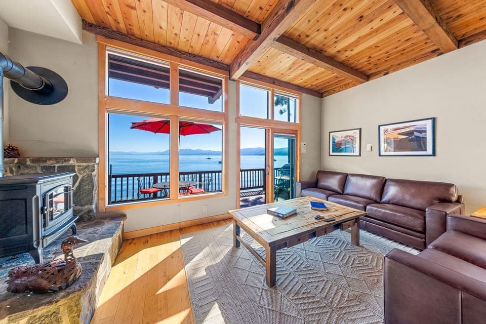 Living Room with Lake View Balcony and Fireplace