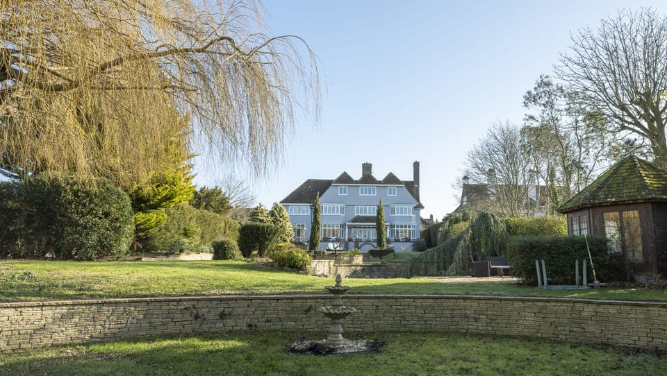 Back view of house from middle of the extensive garden 