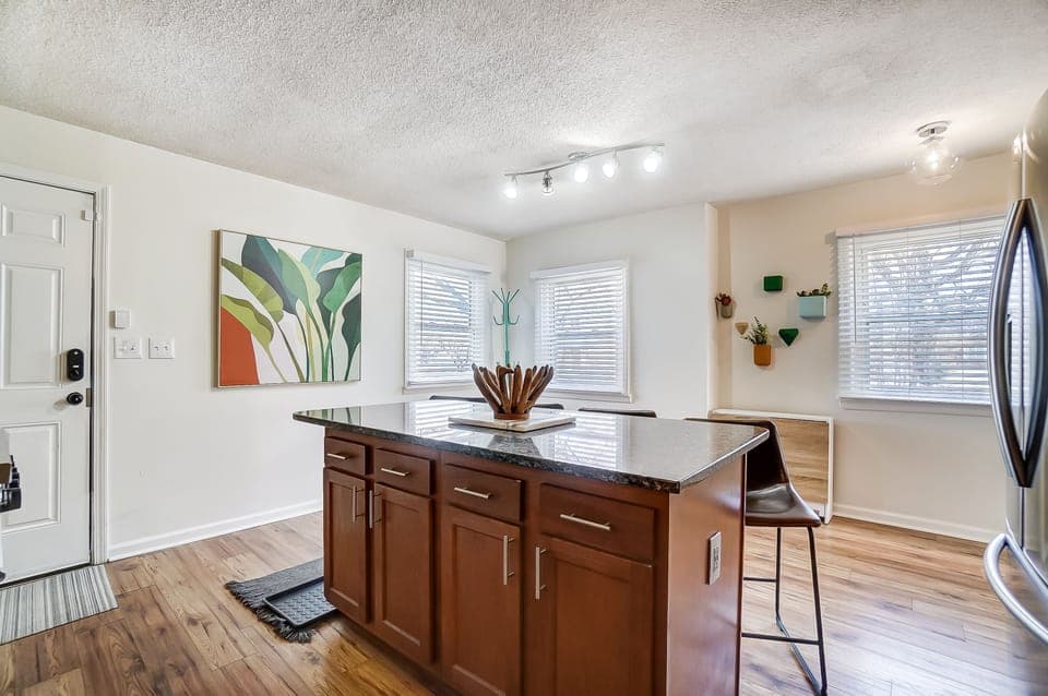 Folding wood and white table for additional dining space if needed