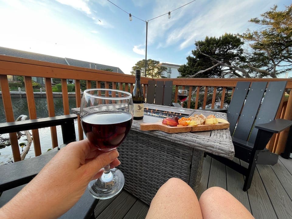 A waterfront deck, hot tub, outdoor grill and fire table provide the atmosphere. All that's missing is you and your complimentary glass of local Pinot Noir to complete the experience.