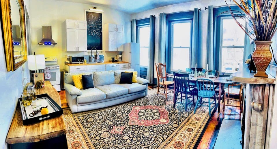 Large windows add to the charm of the great room and provide natural lighting.