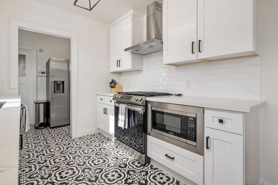 Newly renovated kitchen with stainless steel appliances - includes built in microwave for guest use 