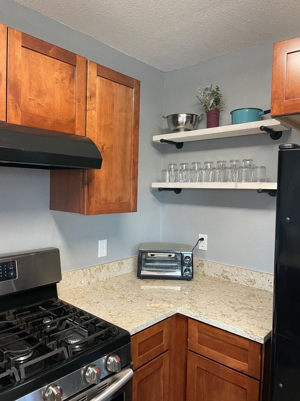 Granite counters wipe clean and open shelving makes finding things so easy!