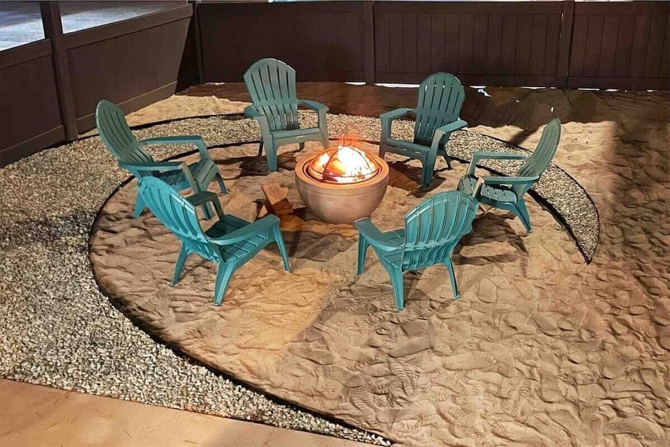 Sand pit is complete with fire pit and chairs for the bonfire experience. When you arrive, there is a tarp covering this area to keep it nice for use. Chairs and pit are on the side of the house. We're always happy to help set up!