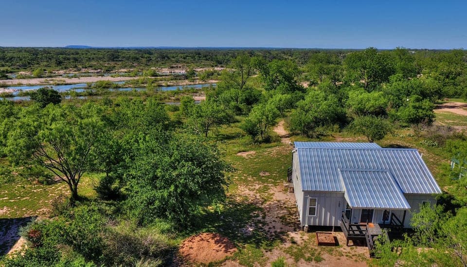 The Llano river flows along the back of the property.