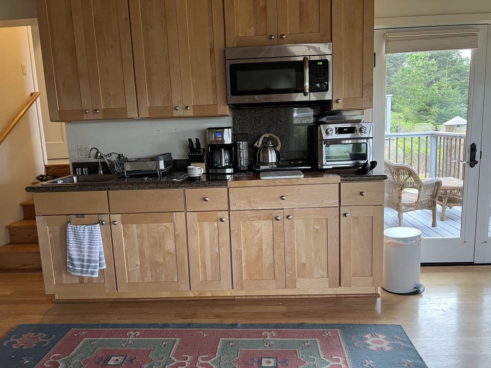 The kitchen has everything you need except food and coffee. BYO. 