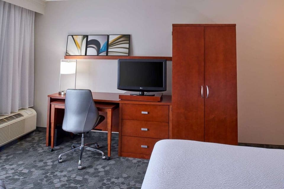 Get productive at the in-room desk with plenty of storage.
