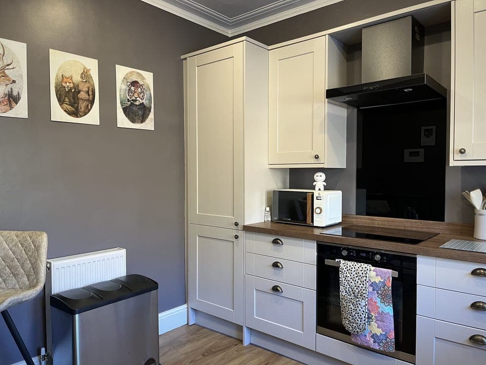 Large kitchen with lots of cupboard space and all appliances you may need.