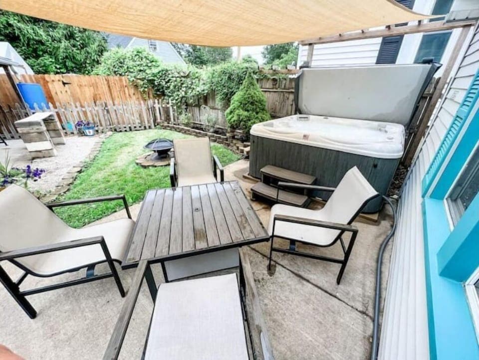 Backyard with private hot tub, fire ring and grill