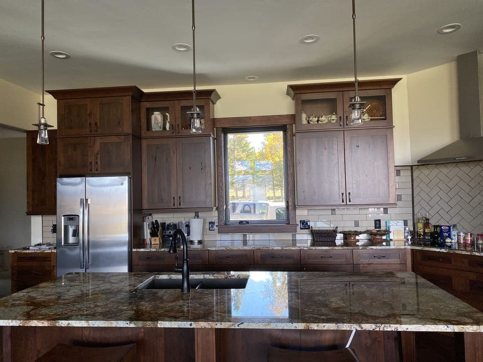 Kitchen with island sink; GE Profile appliances; and induction cooktop.