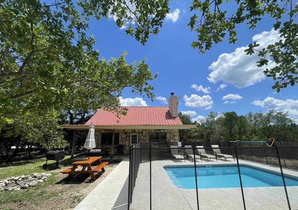 Exterior view of house and swimming pool