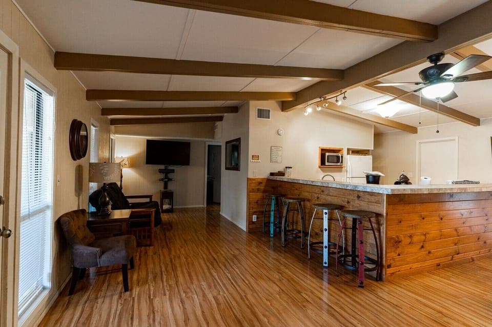 Living room view of bar and kitchen