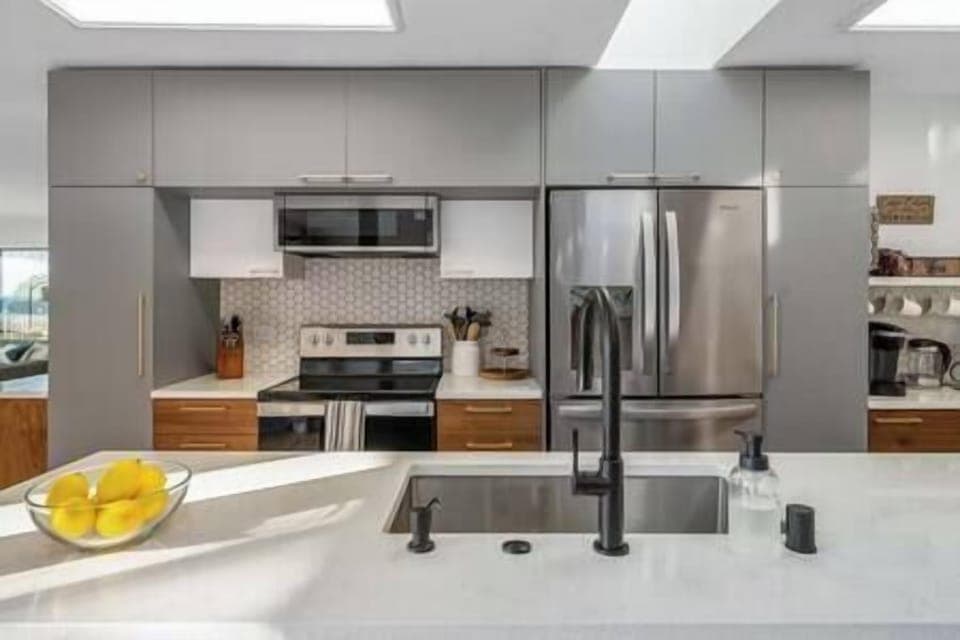 Kitchen adjacent to dining and living room. The kitchen is well stocked to make dinner or cookies!!