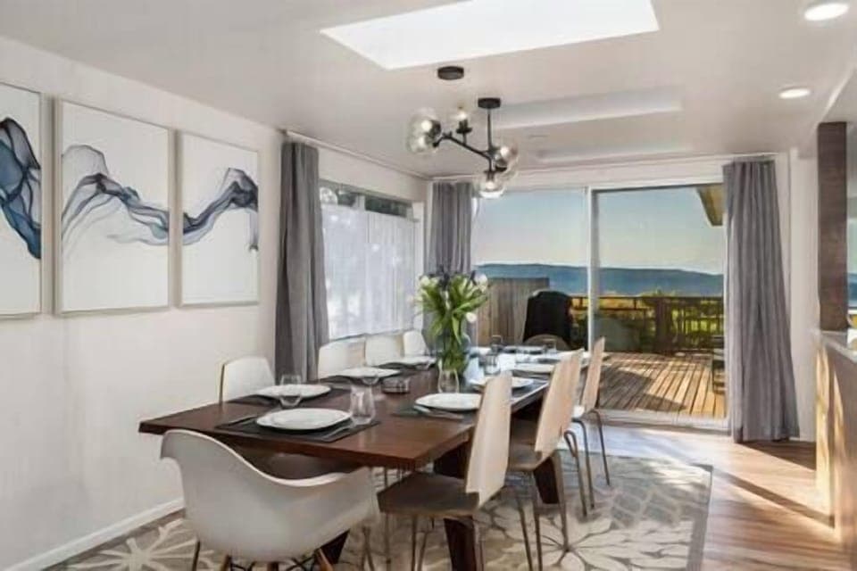 Dining for 10 with a view of Fox Island and the mountains.