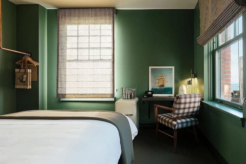 Work, relax, and recharge in a sunlit, stylish bedroom.