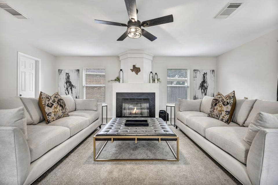 Relax with large cushioned couches in the luxurious family room downstairs. 