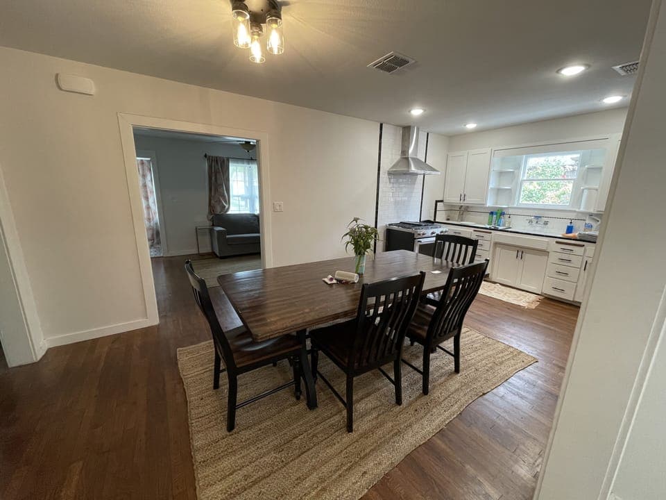 Looking through kitchen to living room from back hallway