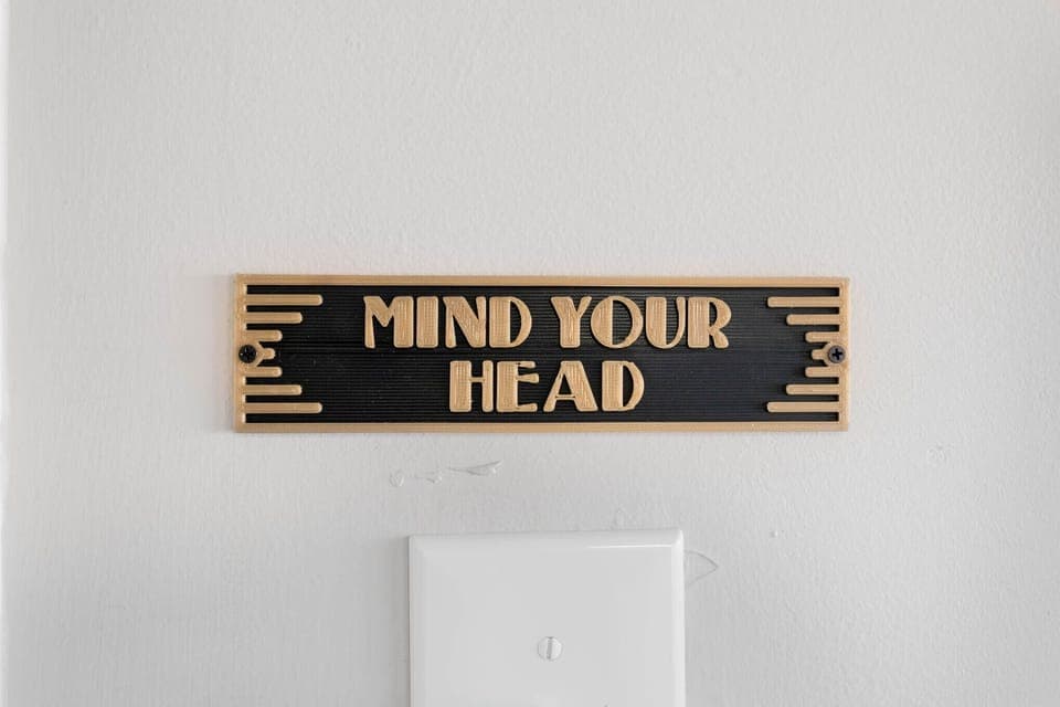 'Mind Your Head' in the lower part of the laundry room