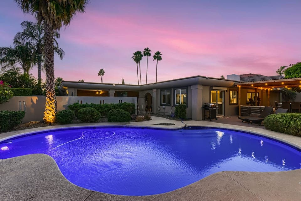 Resort style pool w/ lighted/mister/shaded outdoor dining, relaxing and lounging