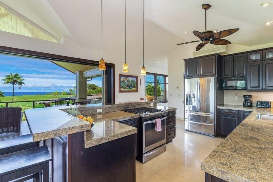 Gourmet Kitchen - Large gourmet kitchen with ocean and golf course view, perfect for watching the sunset while cooking dinner!