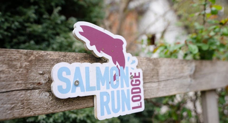 Salmon Run Lodge sign and gate