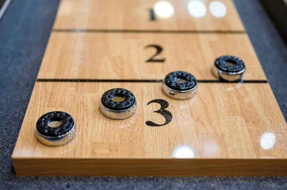 The home also features a full size shuffleboard table so that you can enhance your family game night!
| The Lodge by Boutiq Luxury Vacation Rentals | Broken Bow, Oklahoma