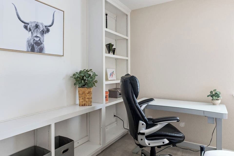 Bedroom 2 with Queen bed + standing desk and desk chair