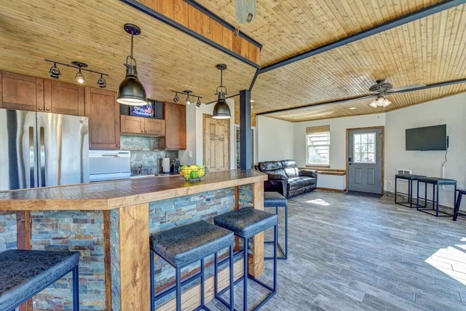 Entertain in the sunroom with a wet bar and additional living room
