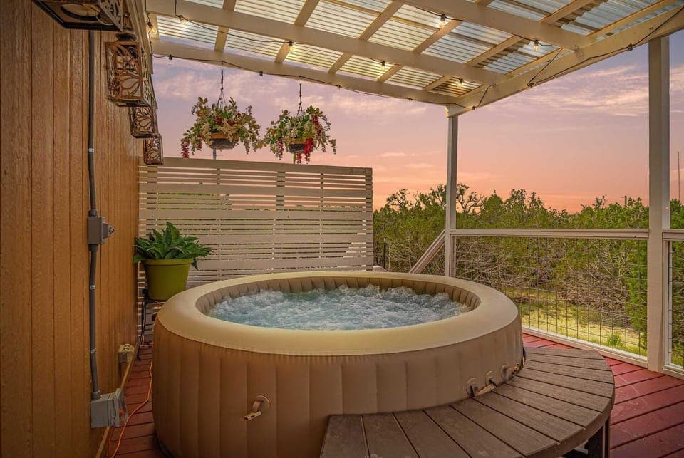 The bubbling and soothing hot tub seats four, and presents a ringside seat for inspiring Hill Country views.