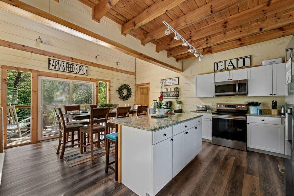 This cabin invites you to cook, connect, and make memories in its spacious open kitchen flowing seamlessly into the cozy living area.