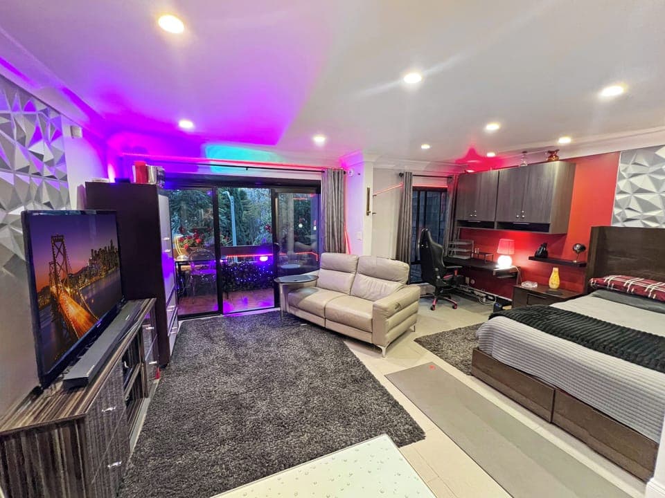 Bright sunny condo with balcony view overlooking best tree lined street in Weho.