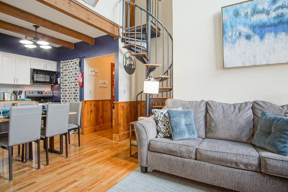 View of spiral staircase from the living/dining area