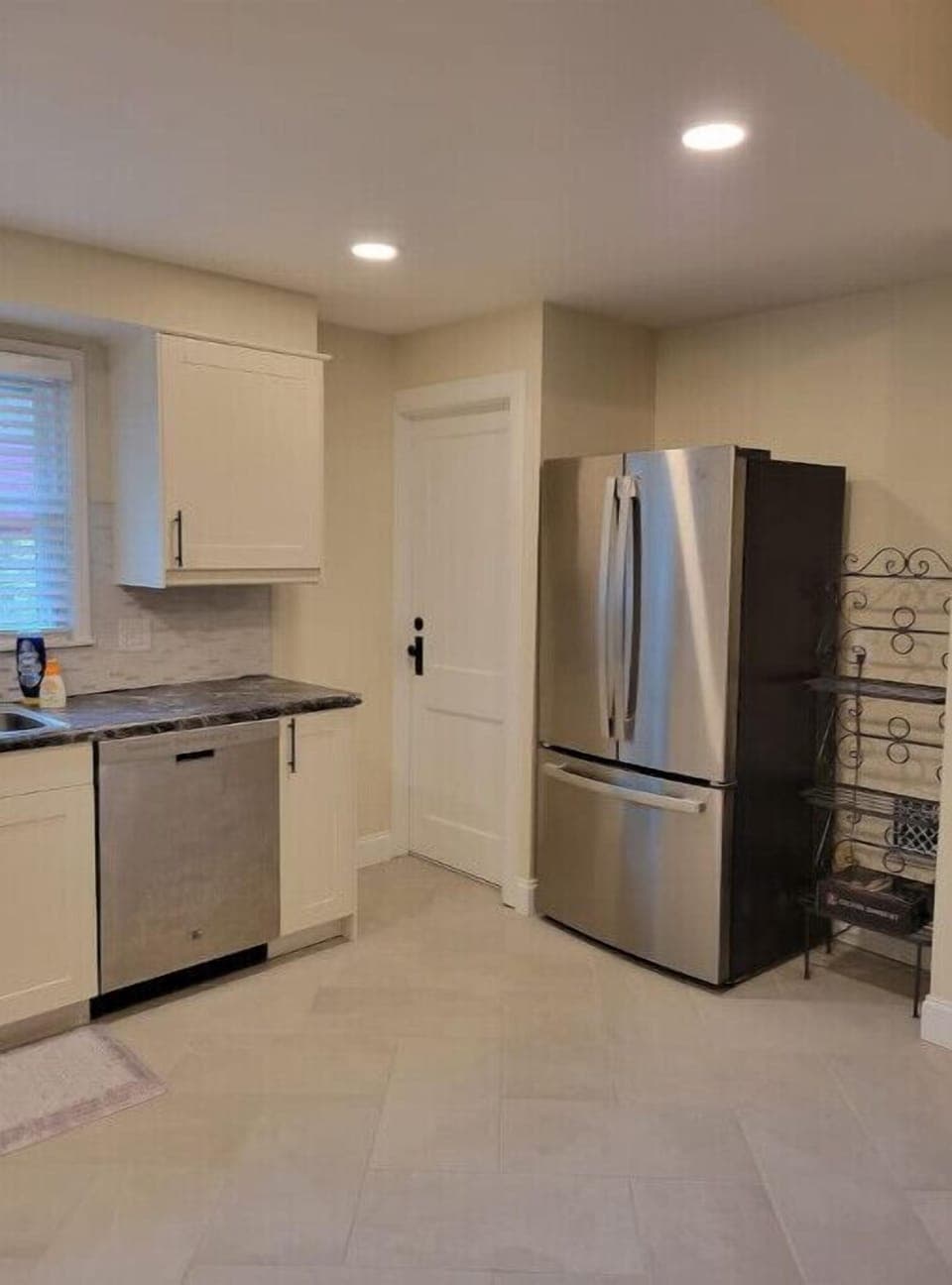 Kitchen with door to backyard 