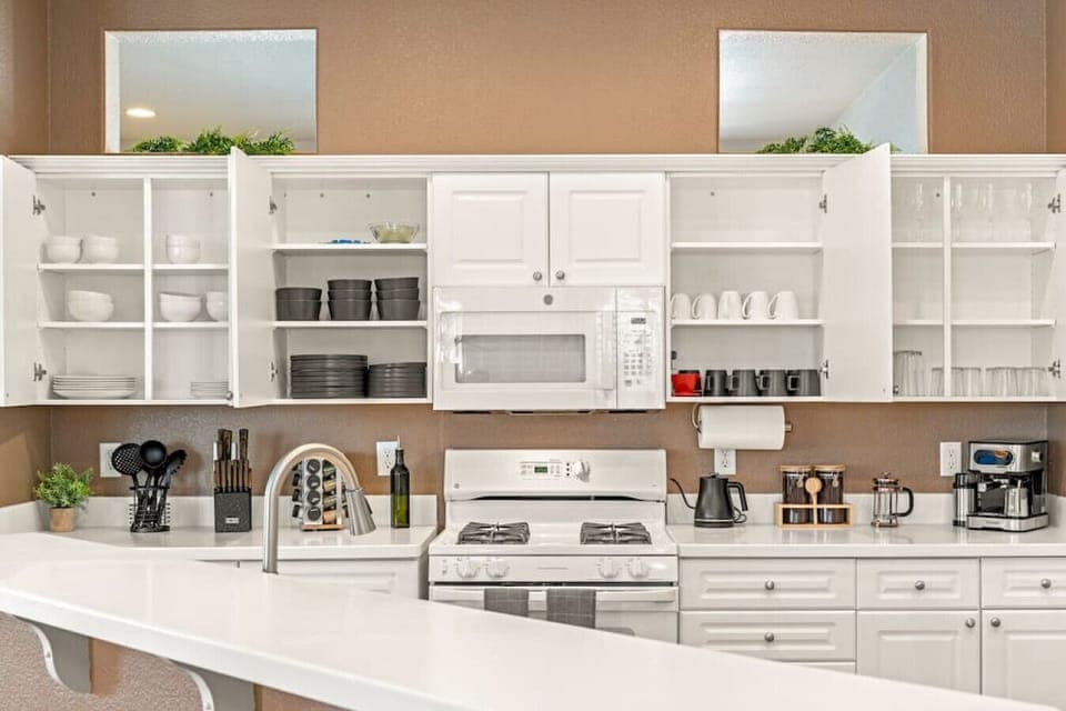 Cook delicious meals in our Chef's kitchen, fully stocked with coffee, cookware, dishes, silverware, oil, spices, and all your other cooking needs.