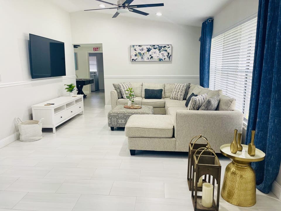 Living room with large sofa, smart tv