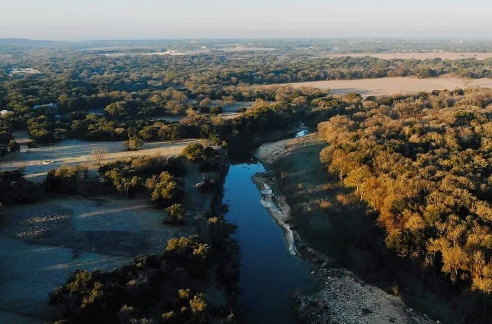 Experience the tranquility of nature with this breathtaking property featuring scenic views of rolling landscapes and a winding creek. Perfect for outdoor enthusiasts or those seeking serene living. Your dream escape awaits!